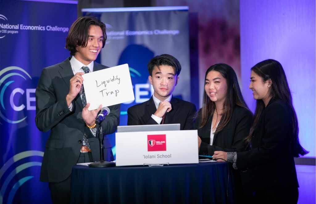 Contestant holding card at Economic Challenge