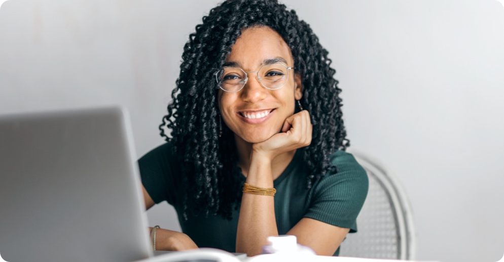 Women smiling at her computer